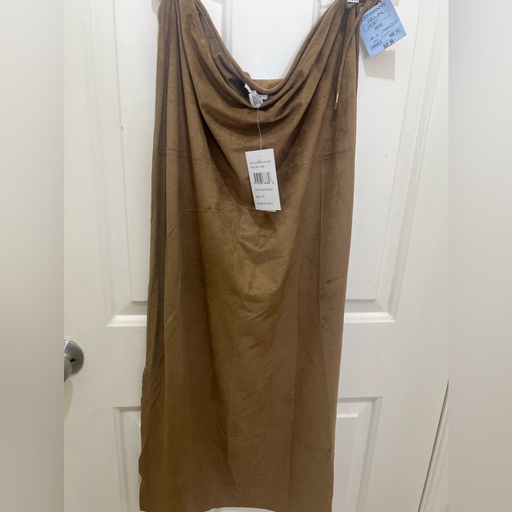 I’m selling a tan color skirt size P/L 100 percent polyester